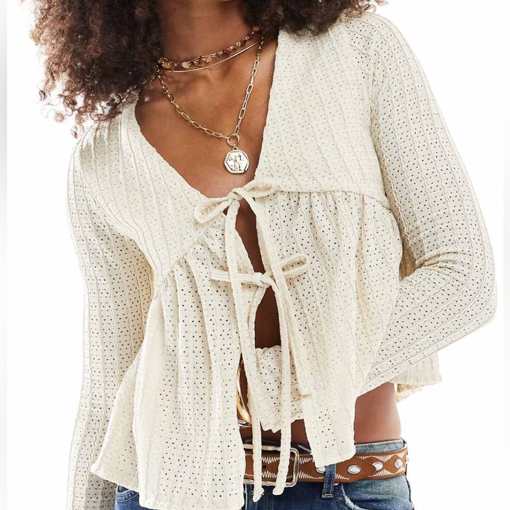 Cream tie front long sleeve peplum top